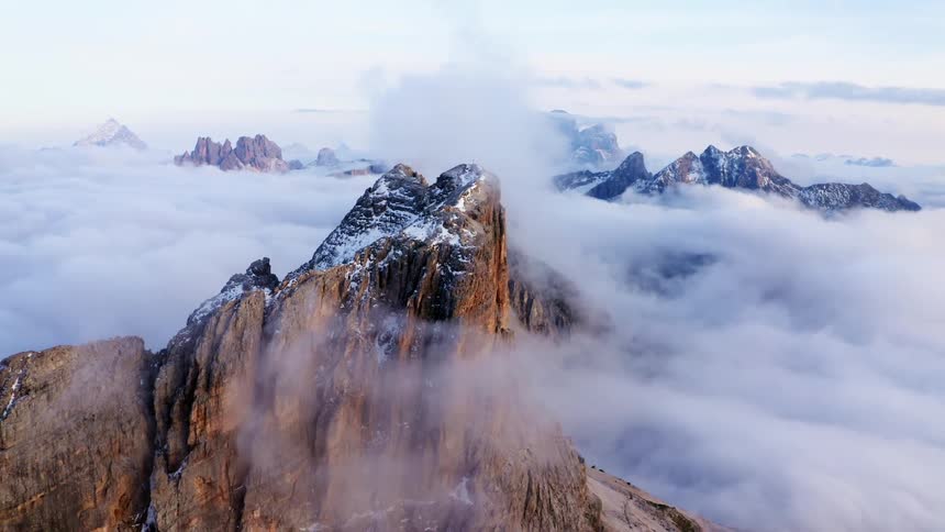 Mountains with snow above the clouds
