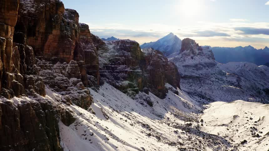 Sun shines on a valley covered with snow