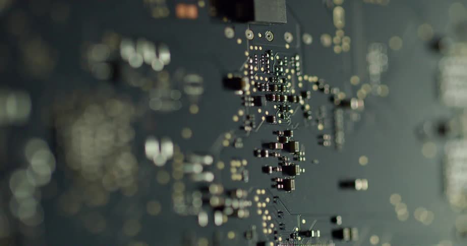 A close up of a component electric board with metal pieces