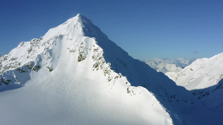 Aerial view of a snow covered mountain range
