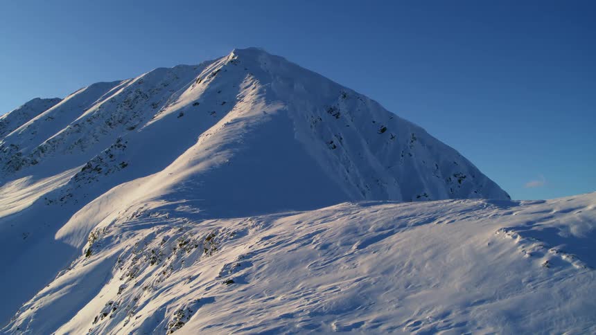 Snow covered mountains on a clear day