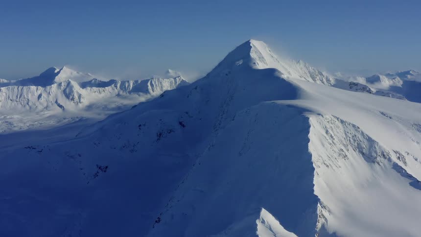 Snow covered mountains on a clear day