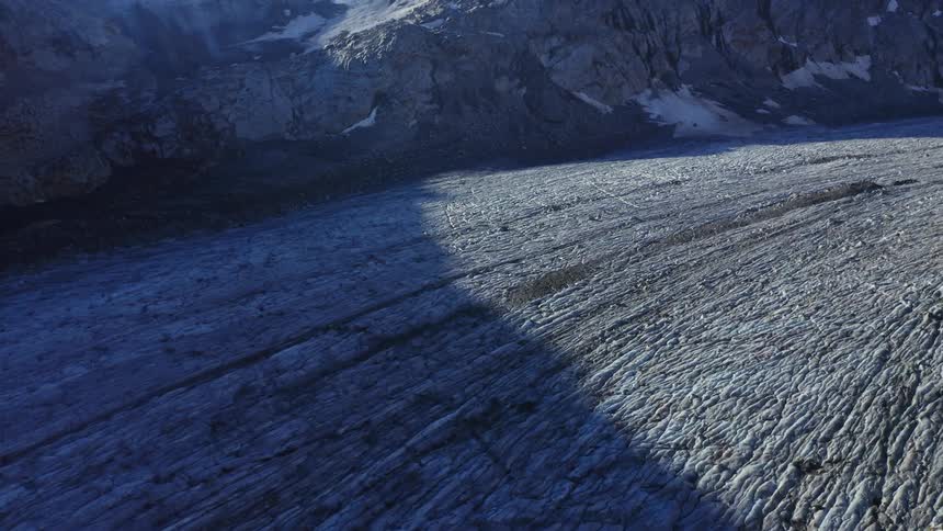 Mountain slope at day time with a walking trail
