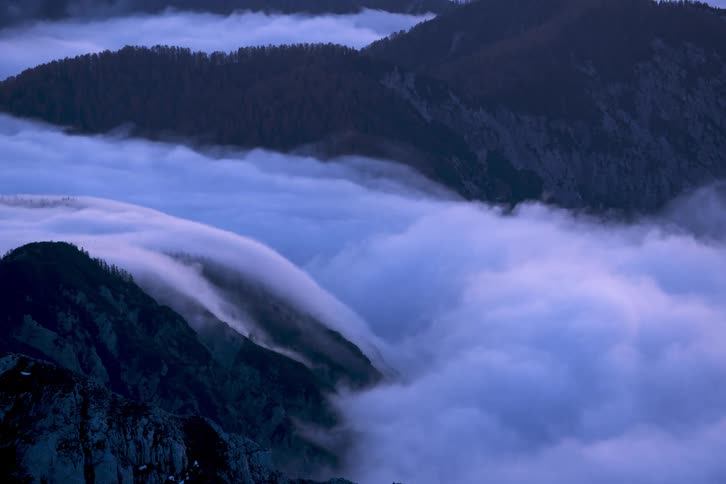 Time lapse of clouds moving over a mountain range