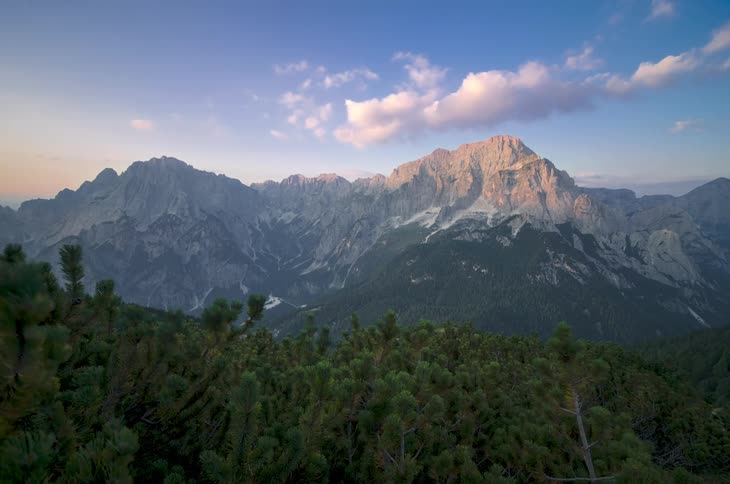 Clouds move across a mountain range