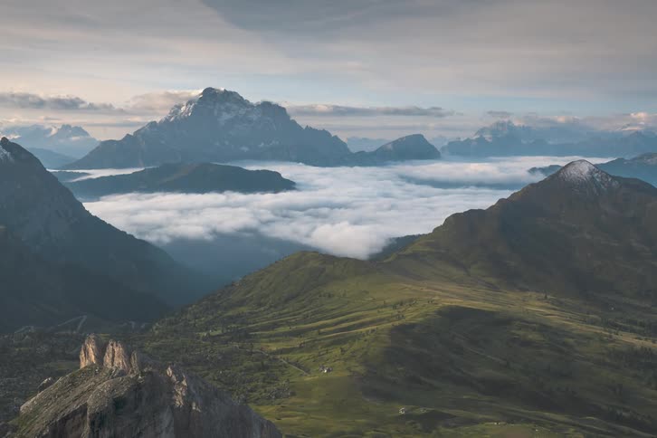Landscape of mountains with clouds moving on horizon