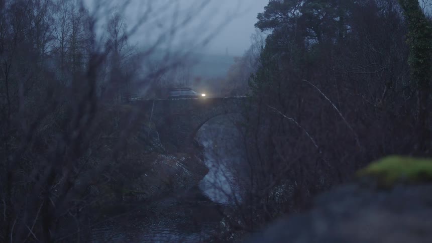A car drives across a bridge