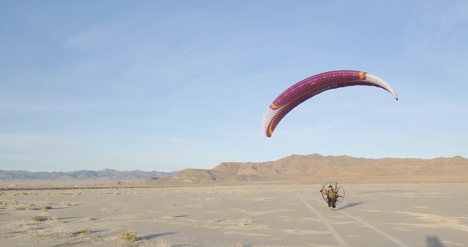 Someone taking off with a paramotor