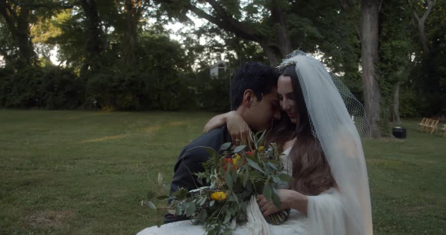 A man carries his bride during a wedding