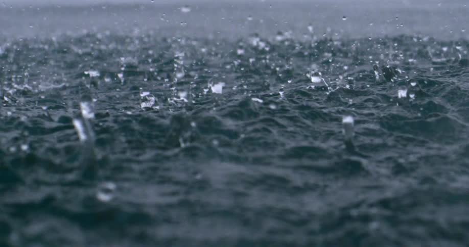Heavy rain causes ocean water to splash upward