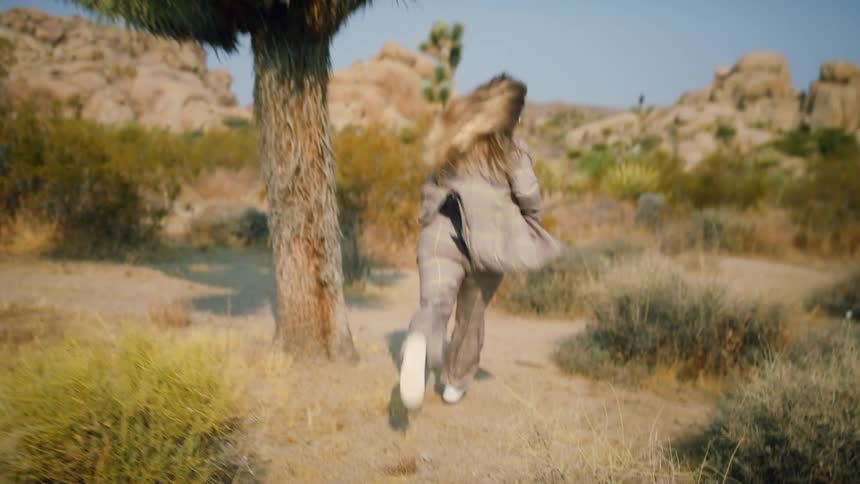 Woman running in the desert