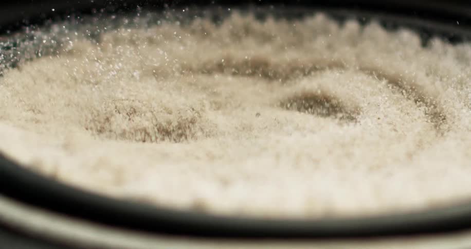 A sand like material shakes and flies around in a centrifuge