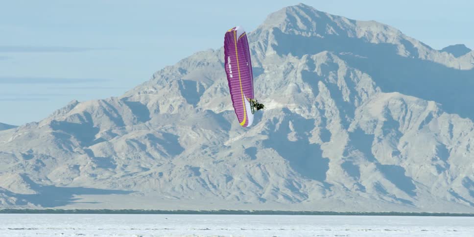 Someone paramotoring in the desert