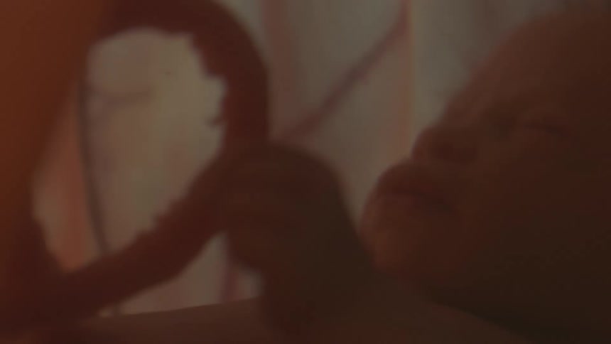 Unborn human baby floating inside the placenta on the womb