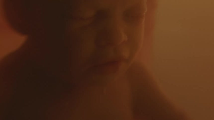 A fetus floating in utero