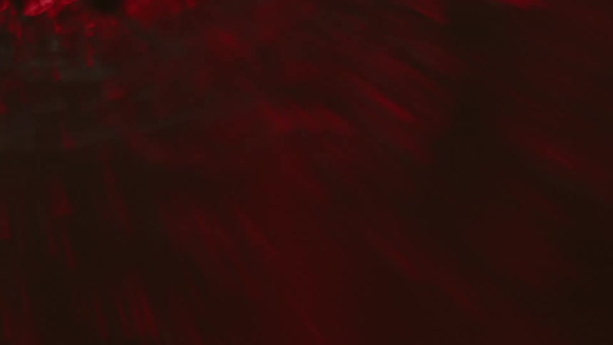 Red liquid moving with ripples