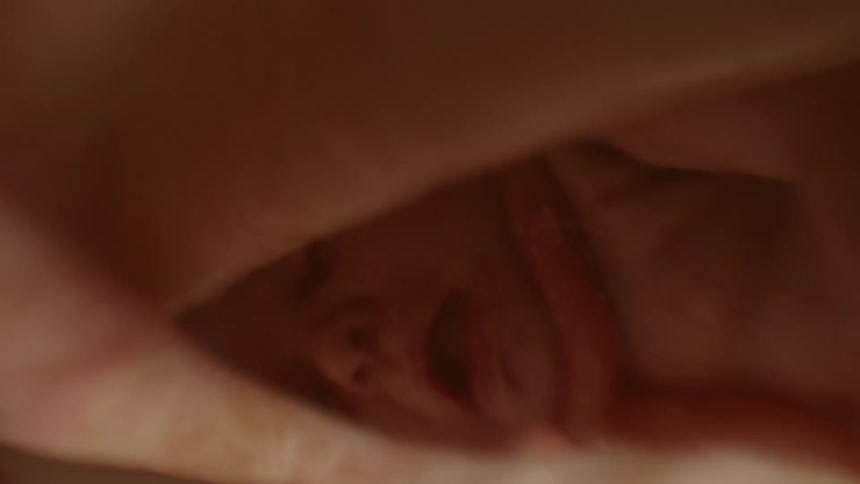 A fetus moves around inside its mothers stomach