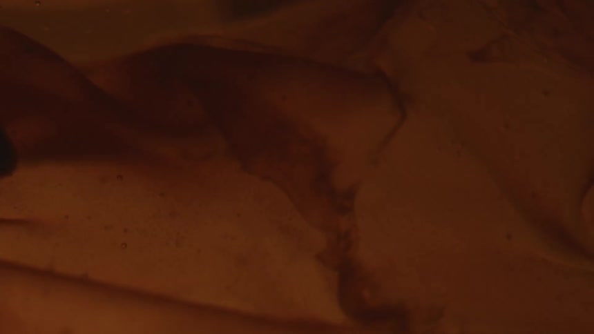 Liquid with layers moving gently in low light