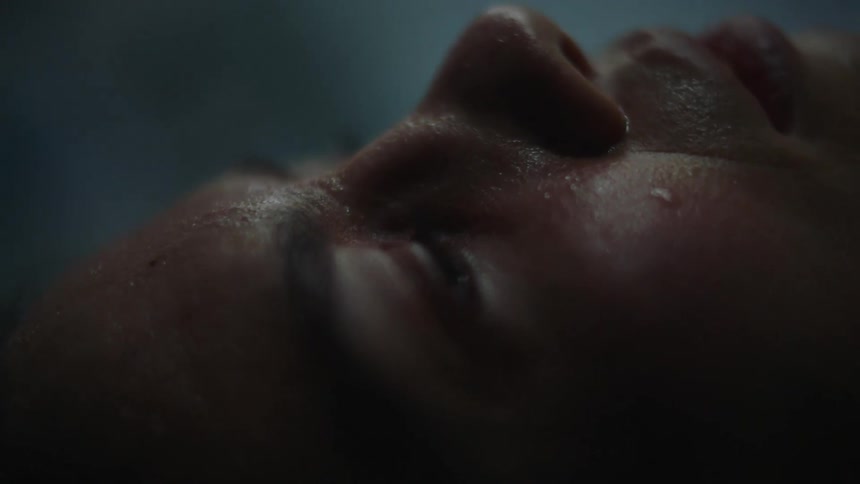 A woman is sweating and breathing heavily while in labor
