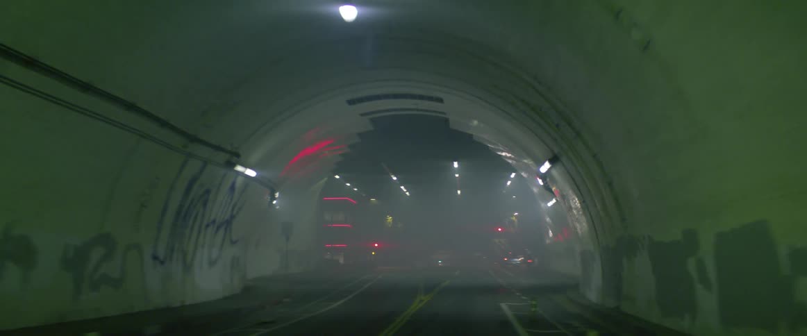 A tunnel that leads to downtown is marked with graffiti