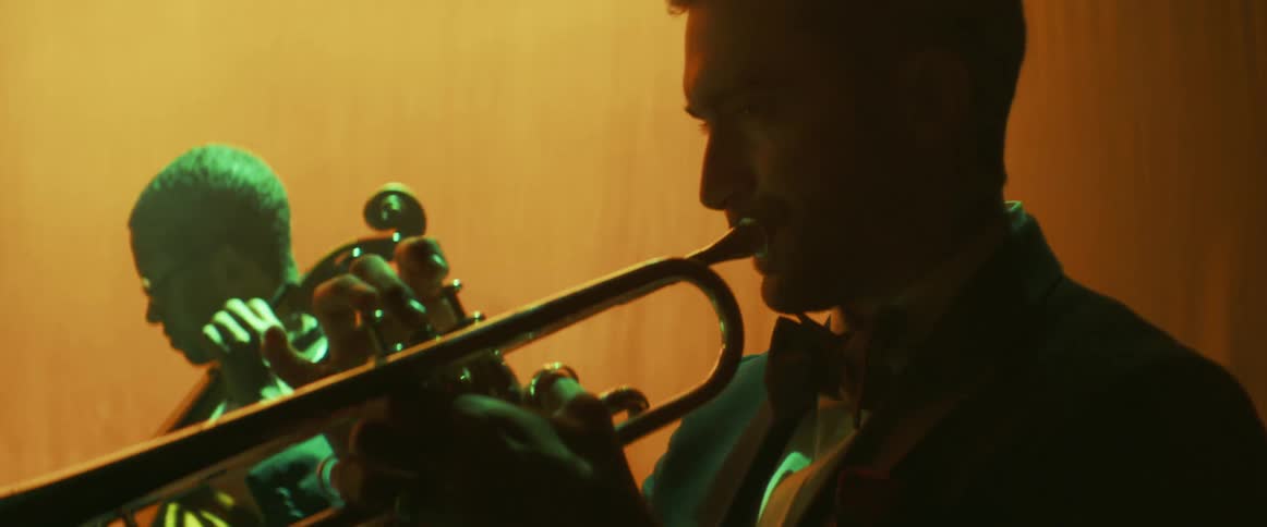 Three musicians performing on stage