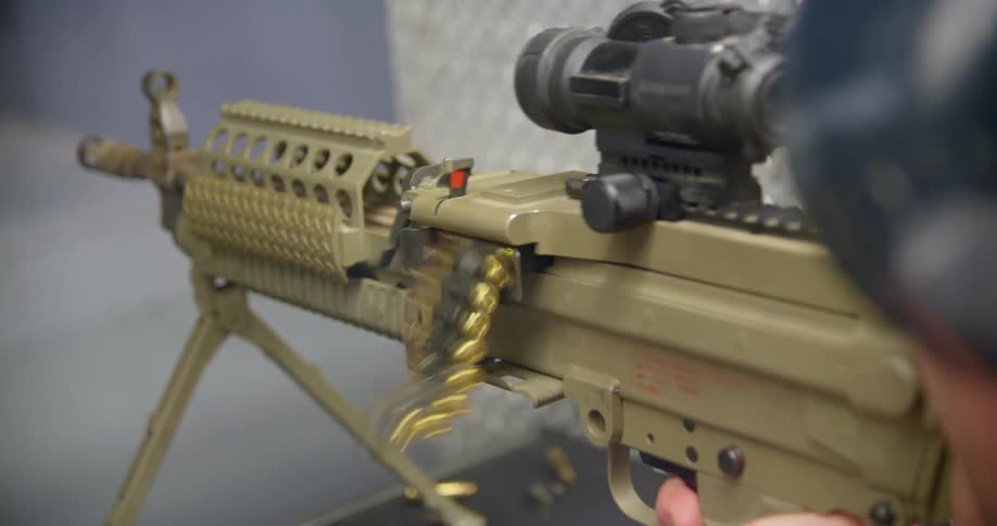 A person shoots an automatic weapon
