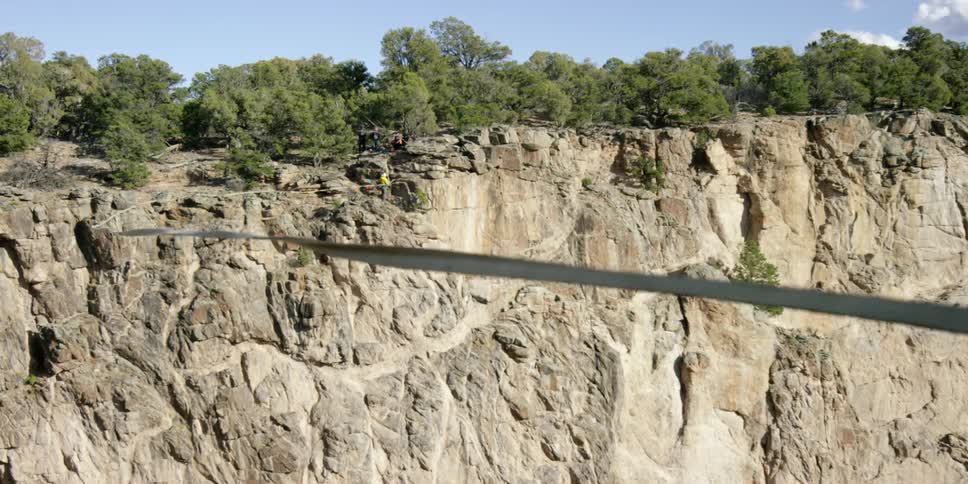 A rope sways over a cavern