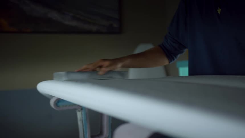 A man standing a counter top