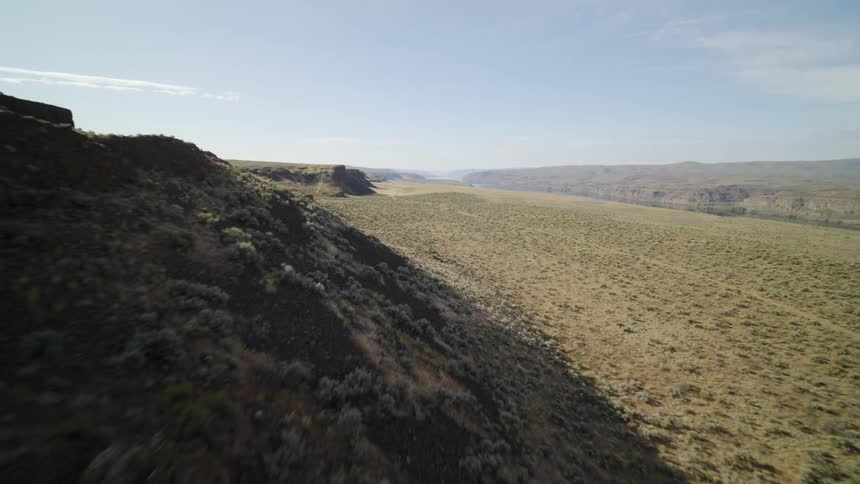 Skimming along a desert ridgeline under the hot sun