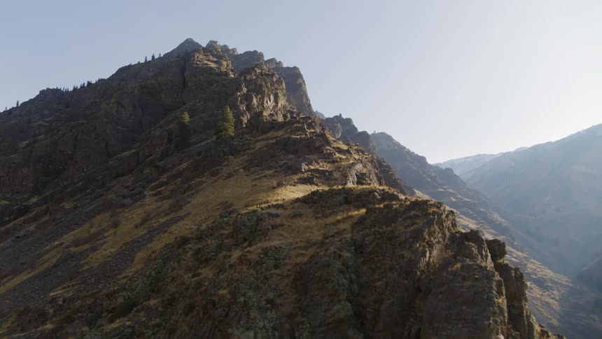 Ascending a steep mountain ridgeline toward the summit