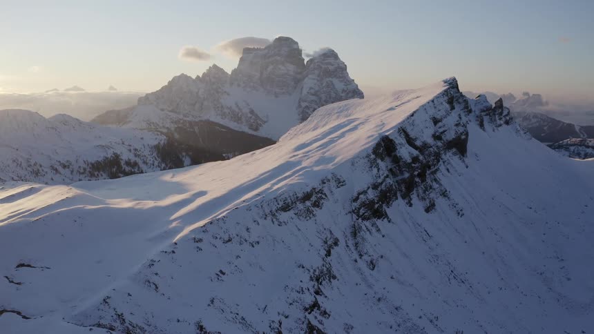 Aerial view of mountains at dusk is displayed