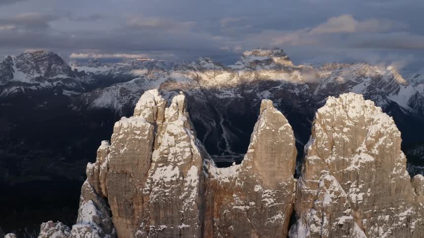 Aerial view of the snow covered jagged peaks of a mountain range