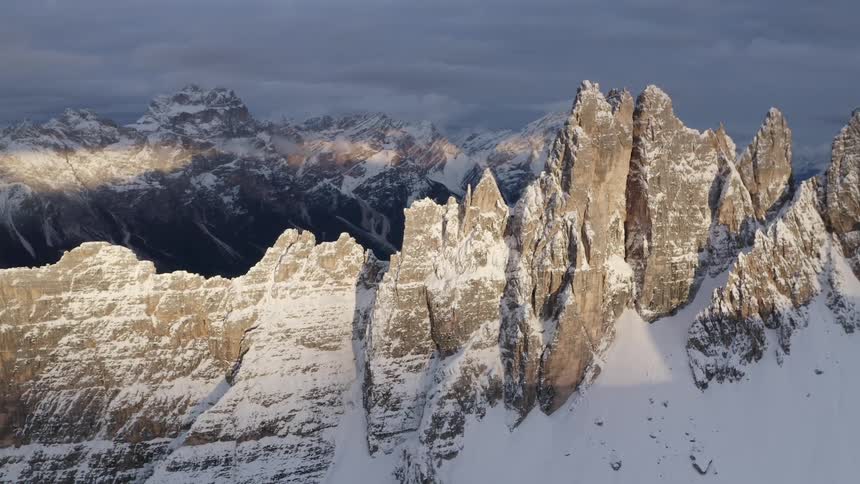 Mountain summit peaks in a cloudy winter sky