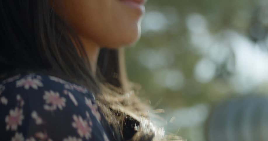 A woman is standing outdoors in spring