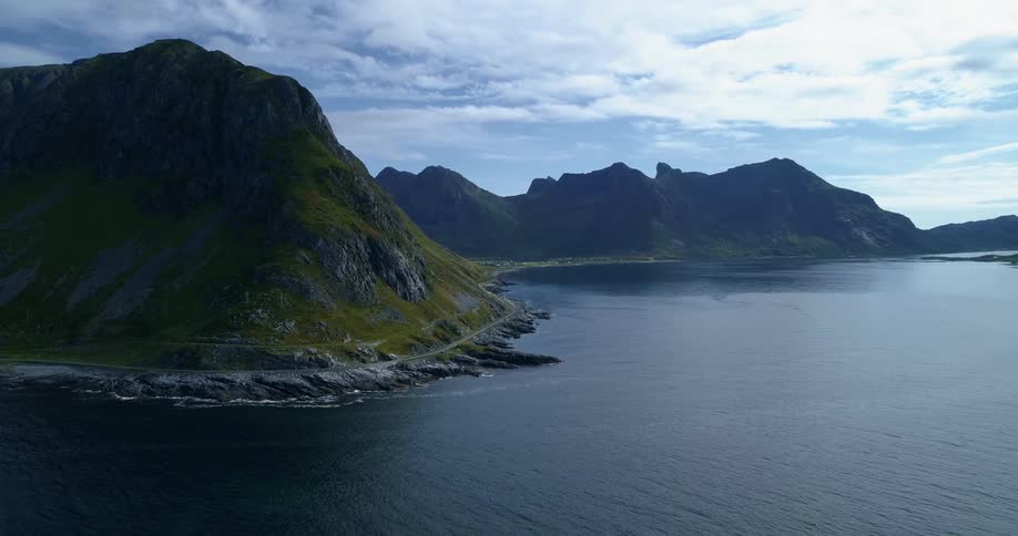 Aerial view of a lake with cliffs on the shore