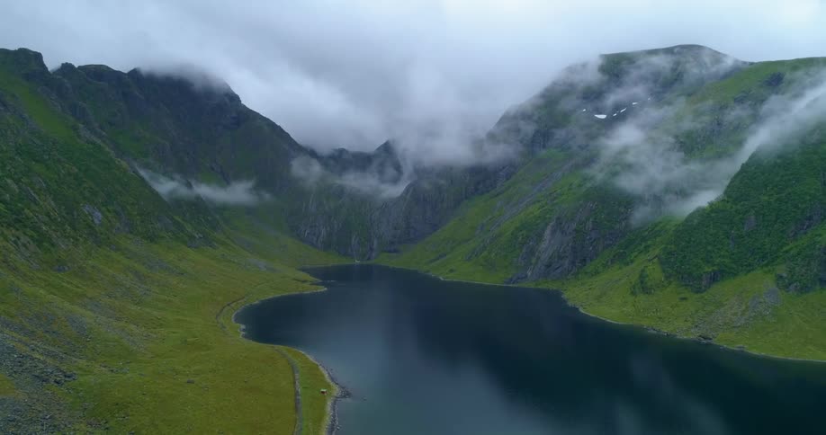 Clouds floating above a mountain lake