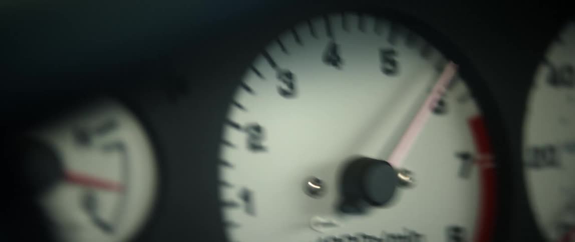 Shaky view of gauges in the dash of a vehicle show very fast movement
