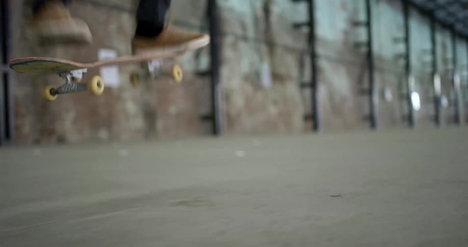 A skateboarder doing a trick while riding on concrete