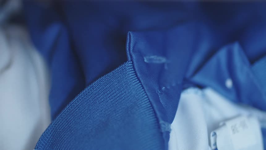 Close up of the seams on a blue piece of clothing