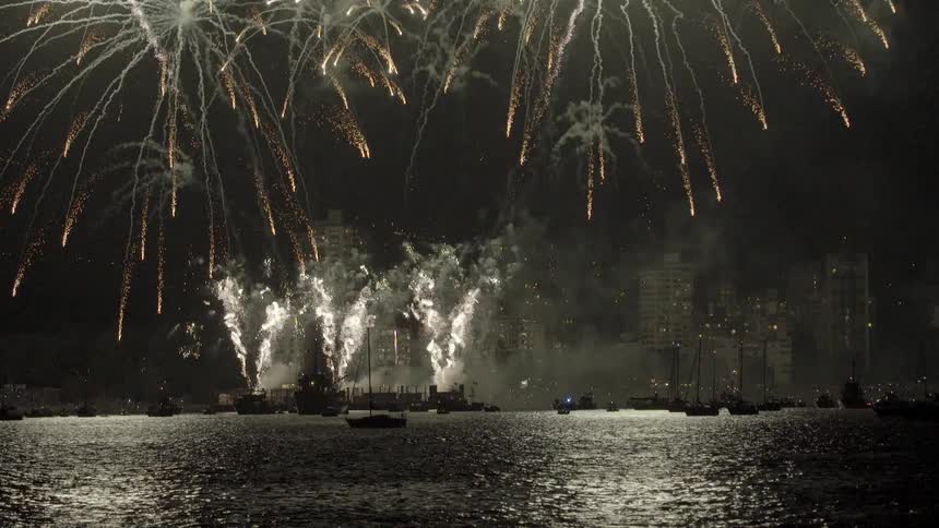 Fireworks shooting over a body of water