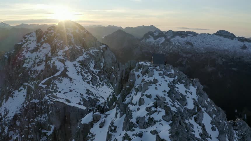 Snow is covering the mountains at dusk