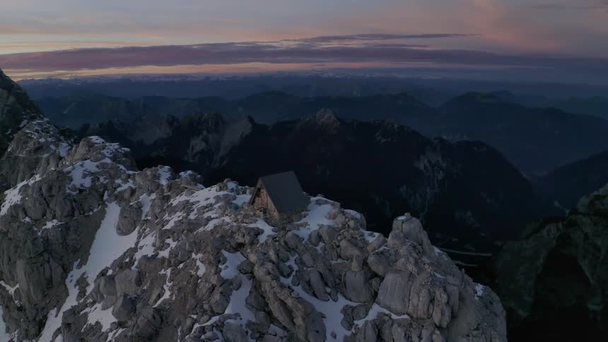 Large rock formations on a snowy mountain range