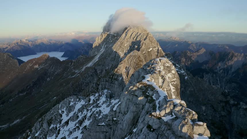 Aerial view of mountains in snow are displayed