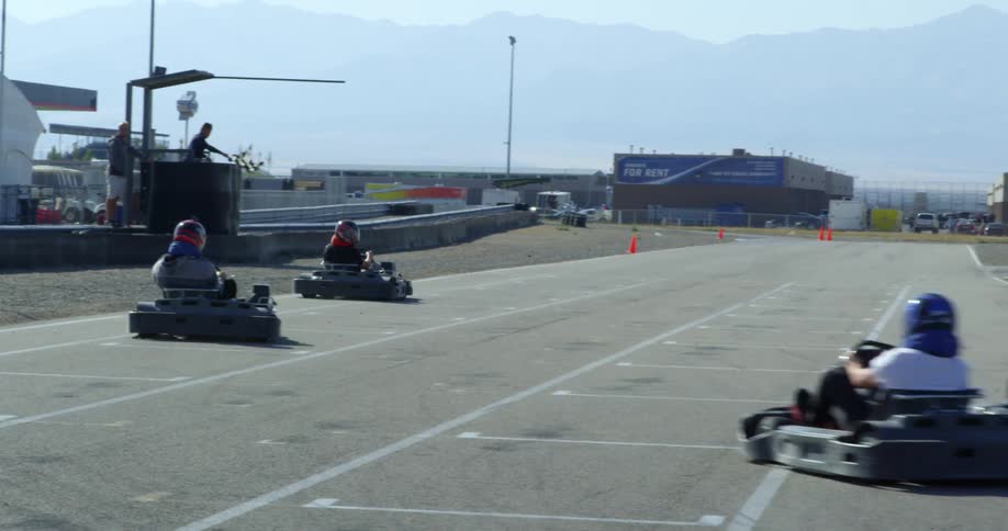 A group of people are racing vehicles