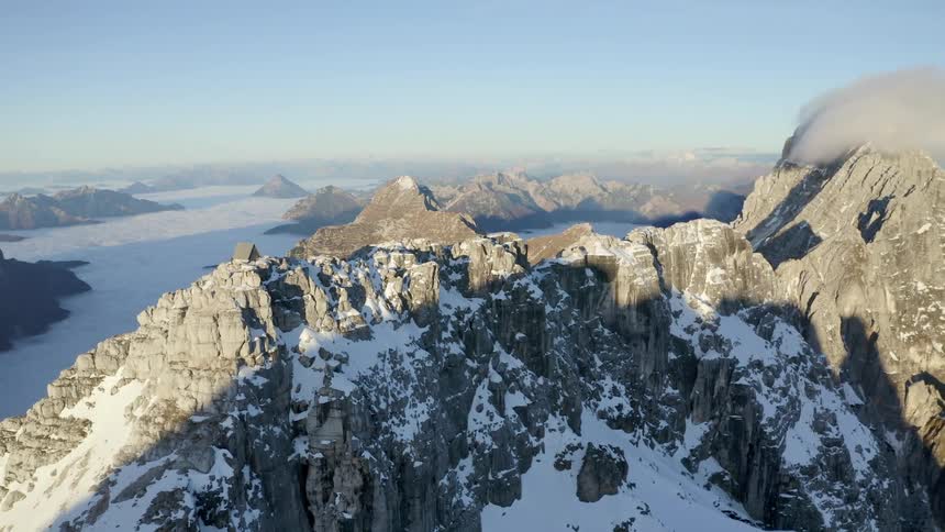 The sun shines on a mountain range