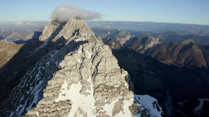 Aerial view of snow covered mountains are displayed
