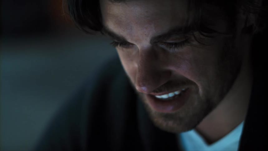 Close up of a young mans face having a video call at home