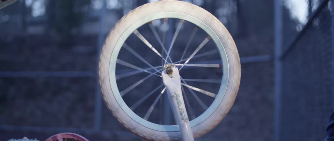 A person is spinning the wheel on their bicycle