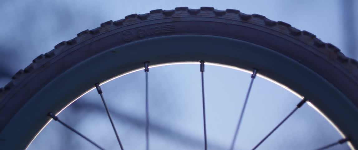A bike tire spinning and coming to a stop