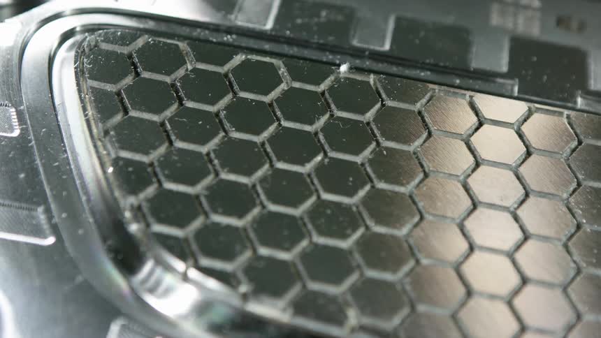 Metal with small hexagonal shapes in the center